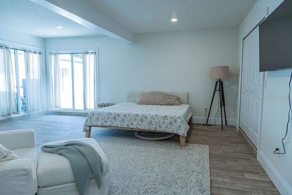 336 Lake Mabel Loop Road Lake Wales, FL 33898 - Photo 8 of 60 a bedroom with a bed and a couch