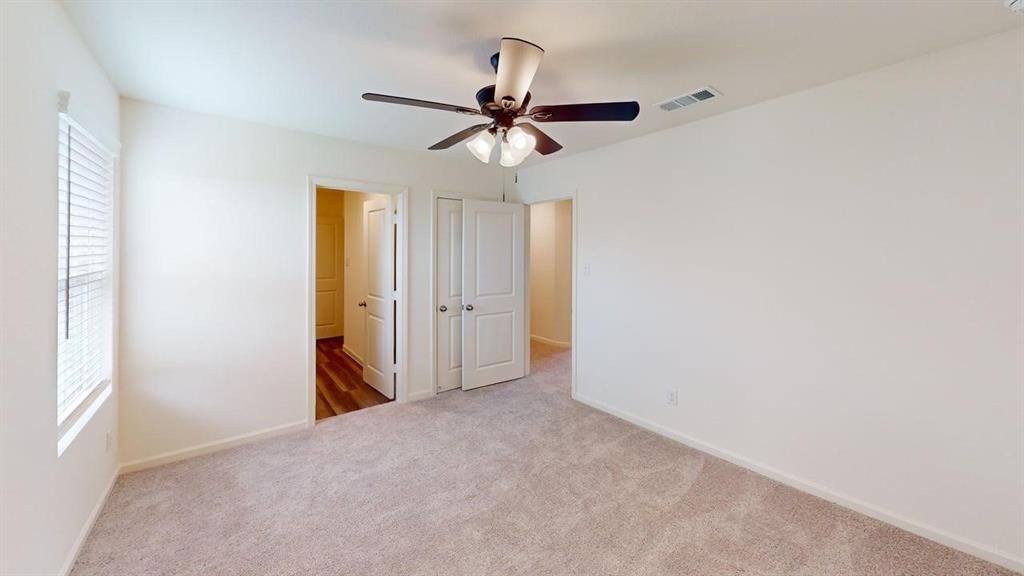 4529 Winecup Road Melissa, TX 75454 - Photo 13 of 29 Carpeted room with a ceiling fan, window with blinds, and white interior doors