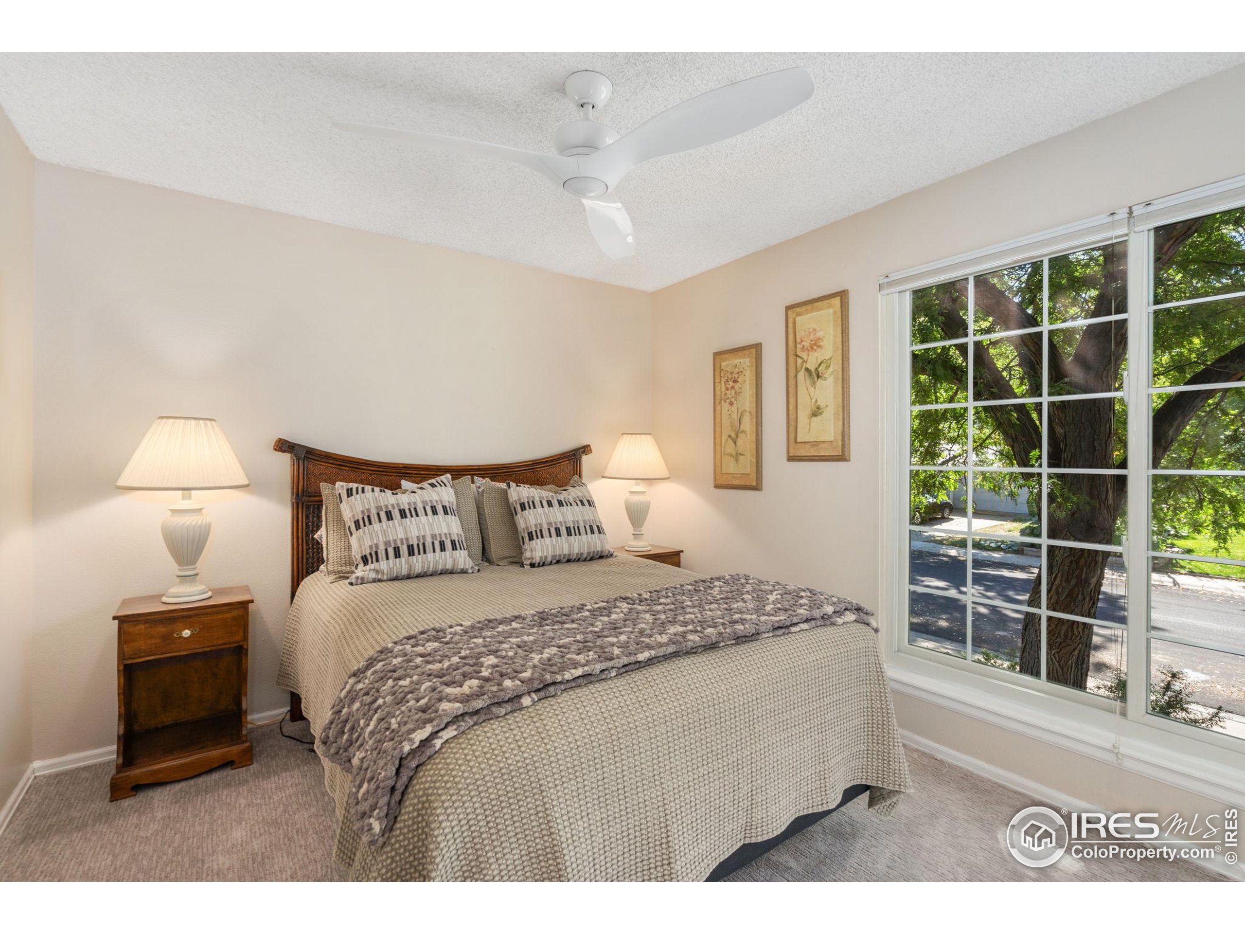 2500 Wapiti Road Fort Collins, CO 80525 - Photo 13 of 34 a bedroom with a bed and a window