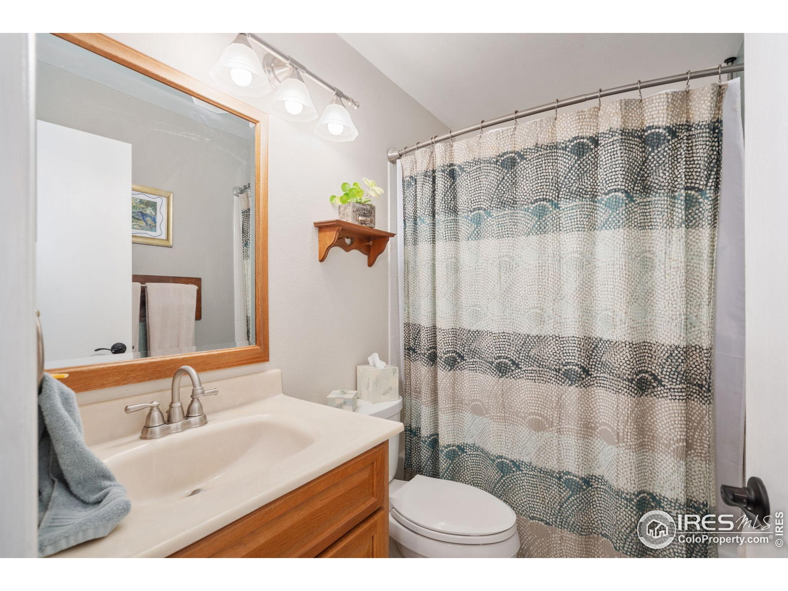 2500 Wapiti Road Fort Collins, CO 80525 - Photo 14 of 34 a bathroom with a sink and a mirror