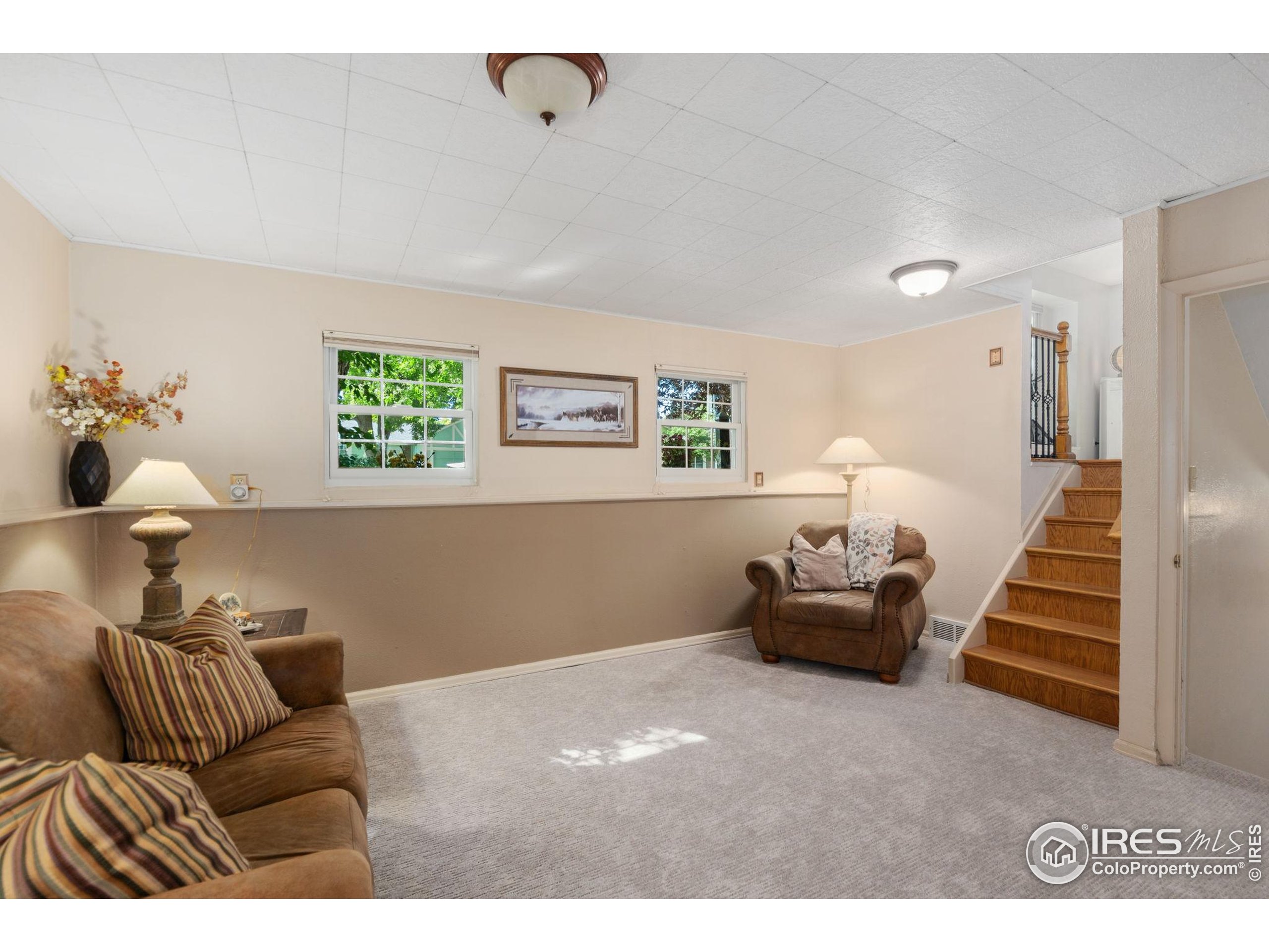 2500 Wapiti Road Fort Collins, CO 80525 - Photo 16 of 34 a living room with furniture and a chandelier