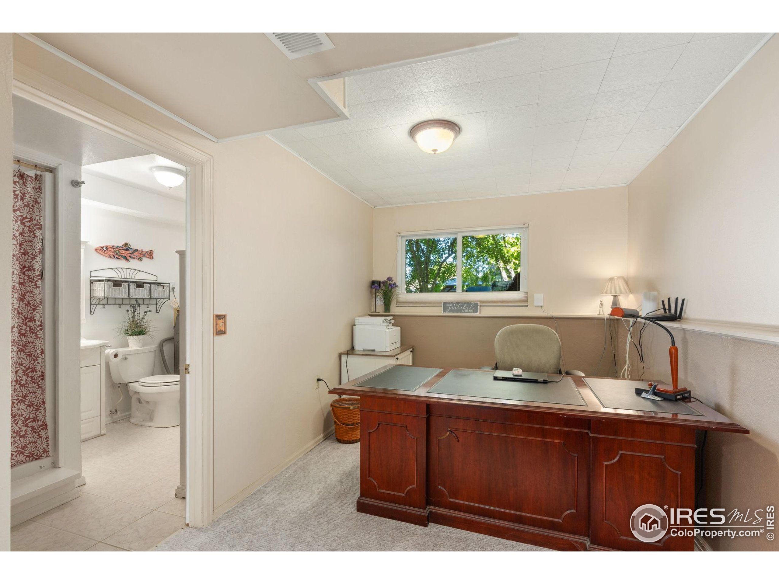 2500 Wapiti Road Fort Collins, CO 80525 - Photo 17 of 34 a living room with furniture and a window