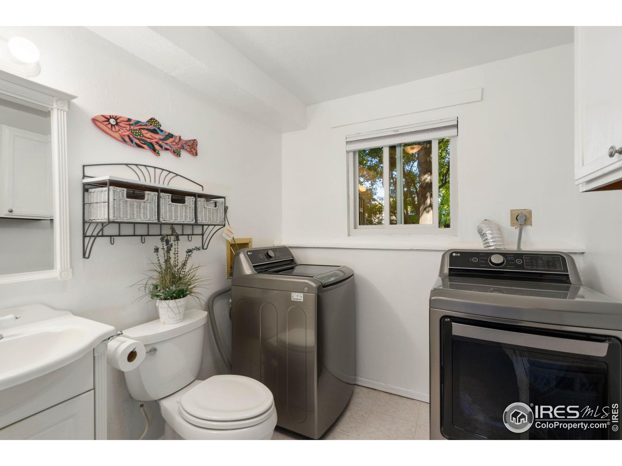 2500 Wapiti Road Fort Collins, CO 80525 - Photo 20 of 34 a bathroom with a toilet a sink and a window