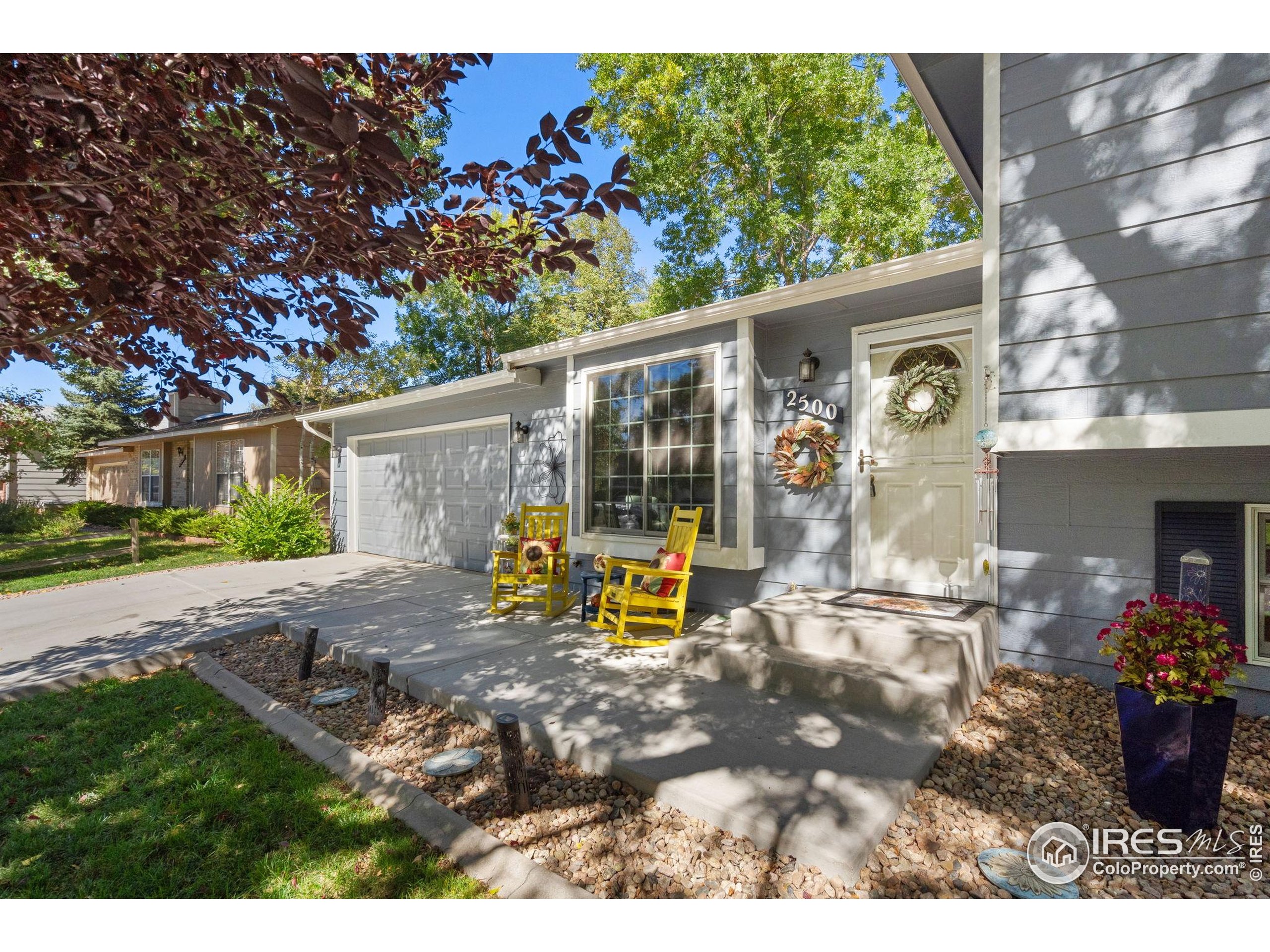 2500 Wapiti Road Fort Collins, CO 80525 - Photo 3 of 34 a view of a house with backyard sitting area and garden