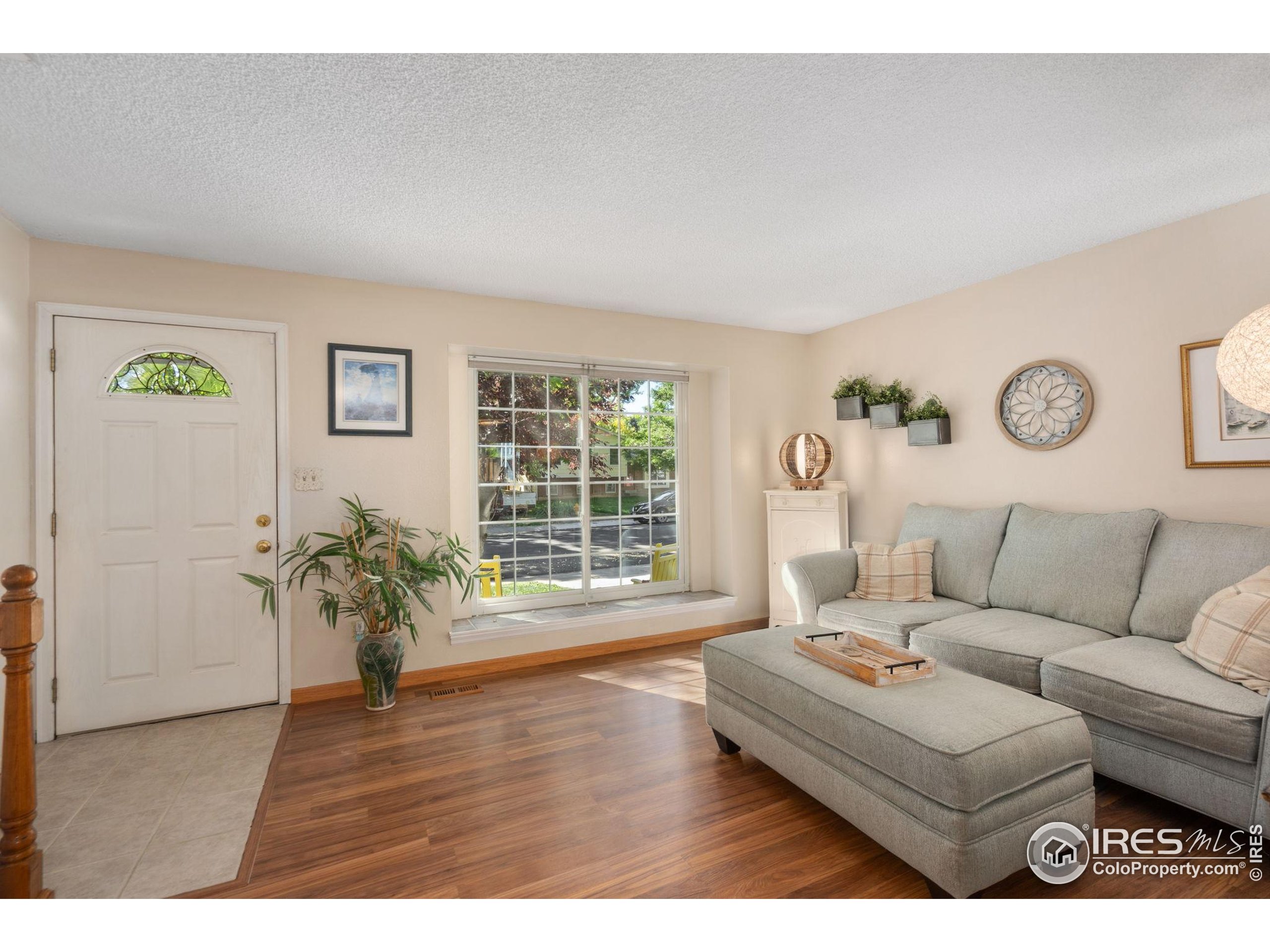 2500 Wapiti Road Fort Collins, CO 80525 - Photo 5 of 34 a living room with furniture and wooden floor