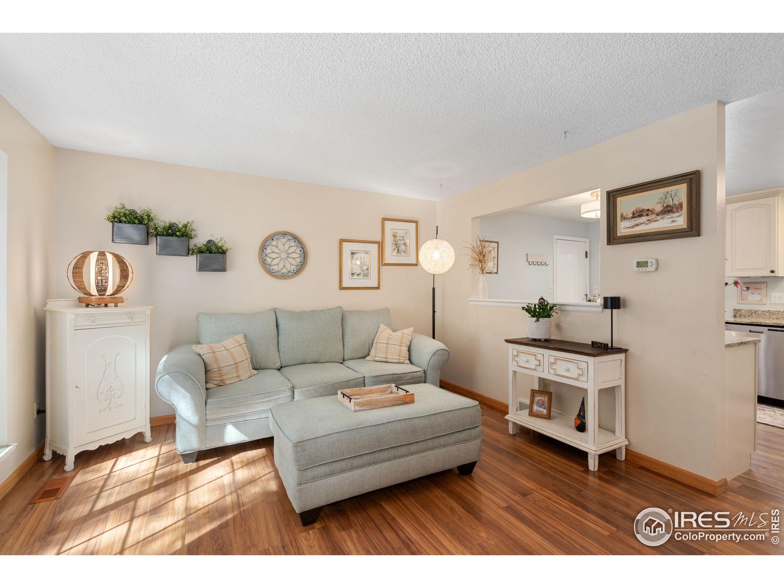 2500 Wapiti Road Fort Collins, CO 80525 - Photo 6 of 34 a living room with furniture and a table