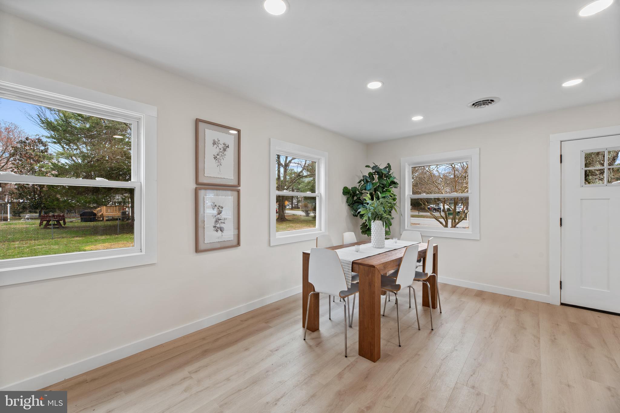 9401 Romancoke Road Stevensville, MD 21666 - Photo 17 of 40 a view of a dining room with furniture window and outside view