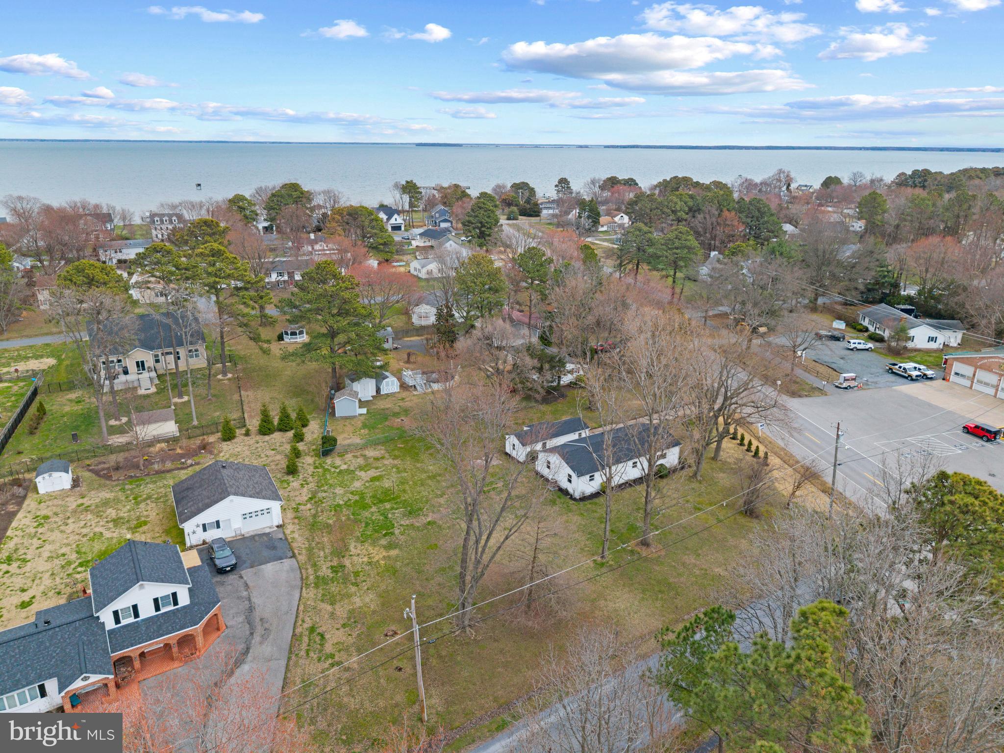 9401 Romancoke Road Stevensville, MD 21666 - Photo 37 of 40 an aerial view of a house with a yard and lake view