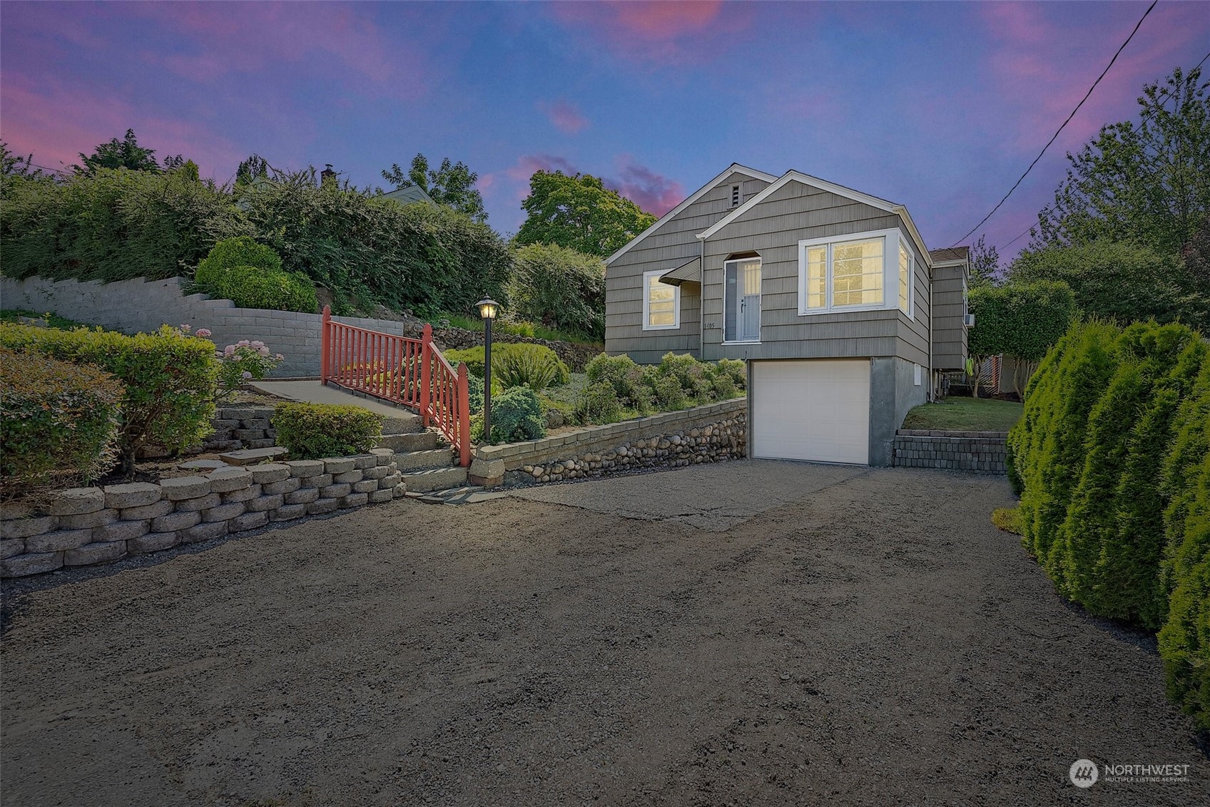 1405 Morris Avenue South Renton, WA 98055 - Photo 1 of 27 a front view of a house with a yard and garage