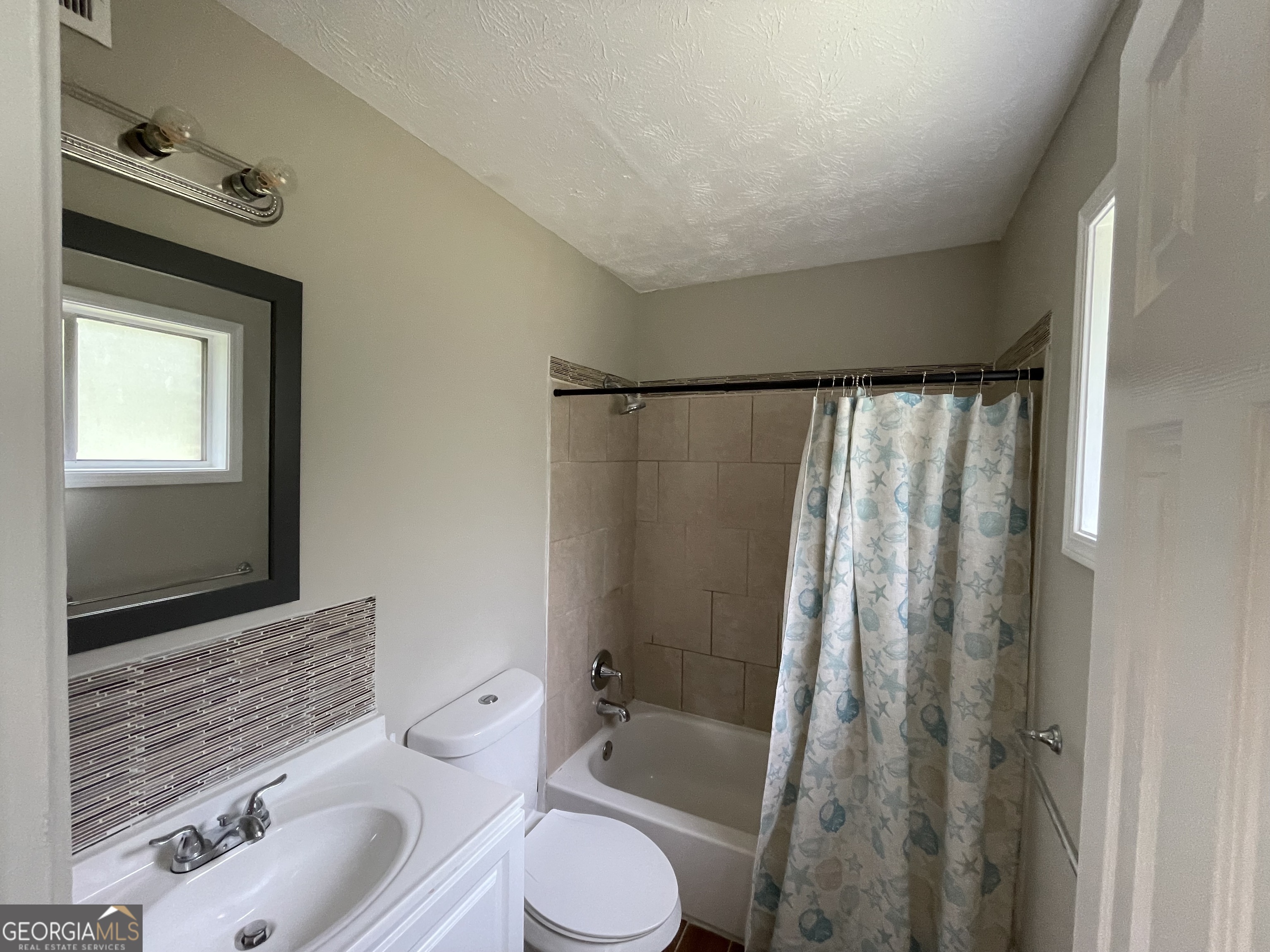3192 Abbeywood Drive Decatur, GA 30034 - Photo 15 of 17 a bathroom with a sink toilet and shower