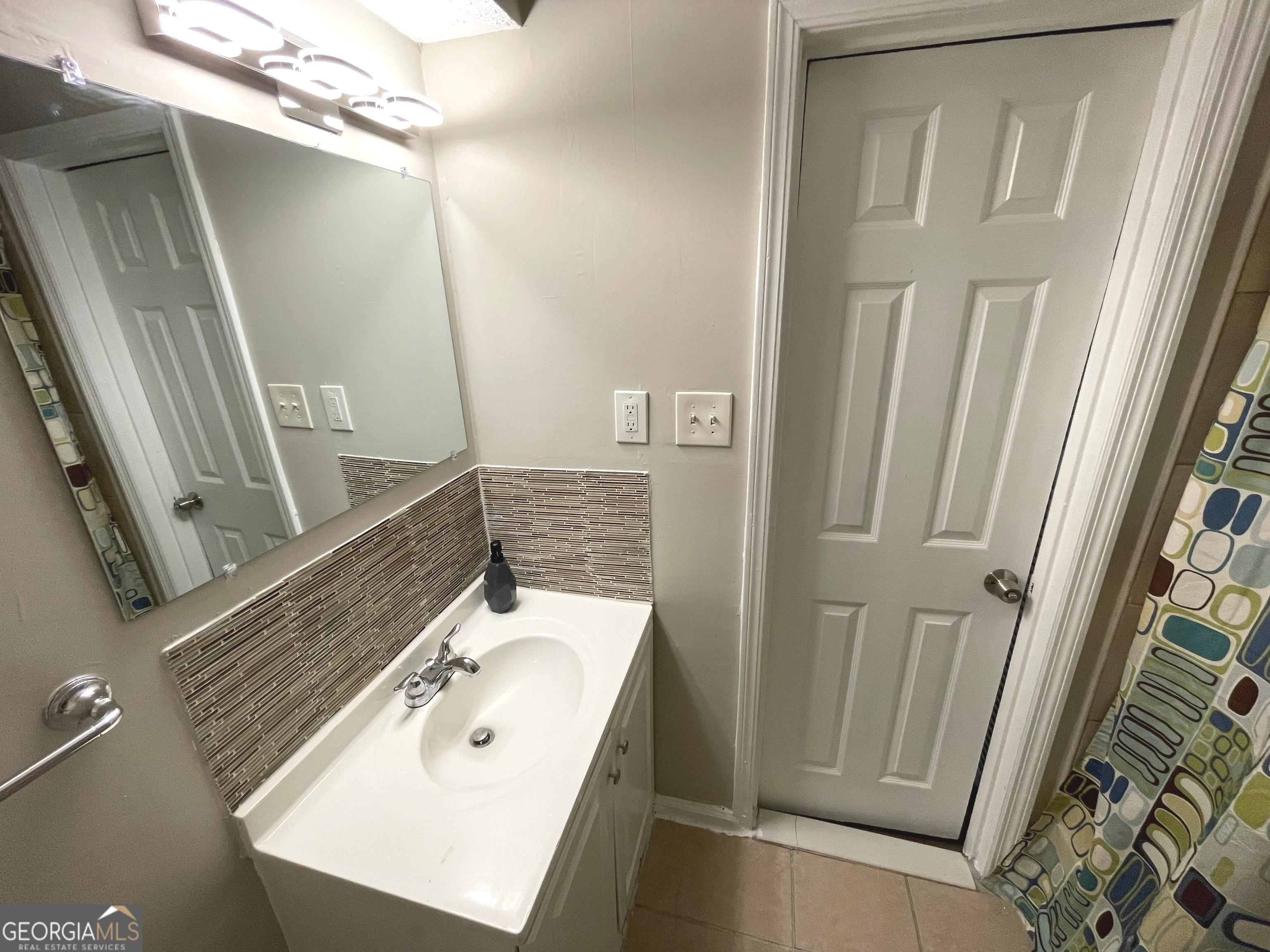 3192 Abbeywood Drive Decatur, GA 30034 - Photo 4 of 17 a bathroom with a sink a mirror and a shower