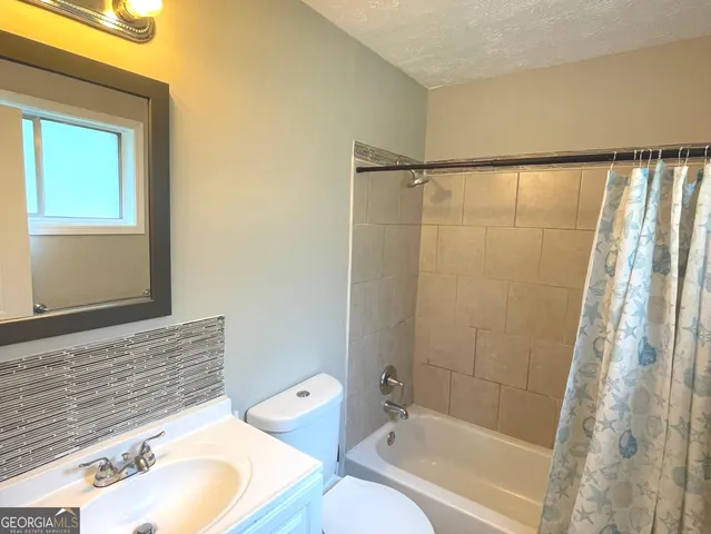a bathroom with a sink and a bathtub