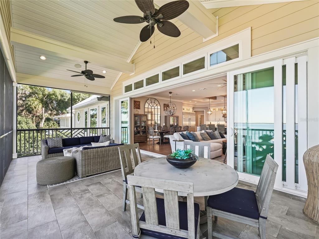12943 Southeast Sunset Harbor Road Weirsdale, FL 32195 - Photo 28 of 87 a view of a dining room with furniture window and outside view