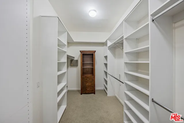 a view of an empty walk in closet