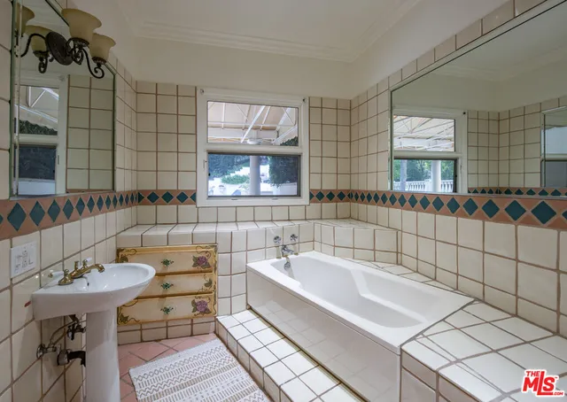 a bathroom with a sink and a bathtub