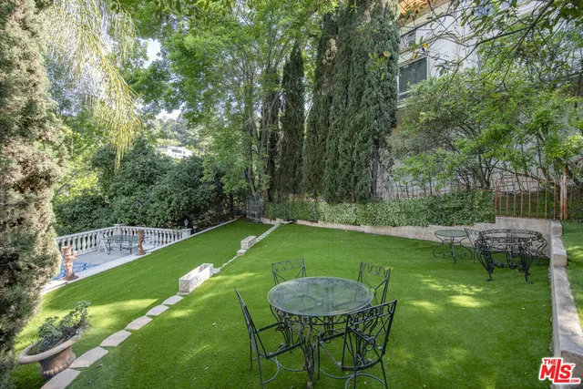 a view of a backyard with a garden