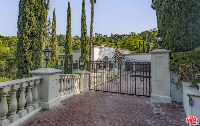 a view of a wrought iron fences in front of house