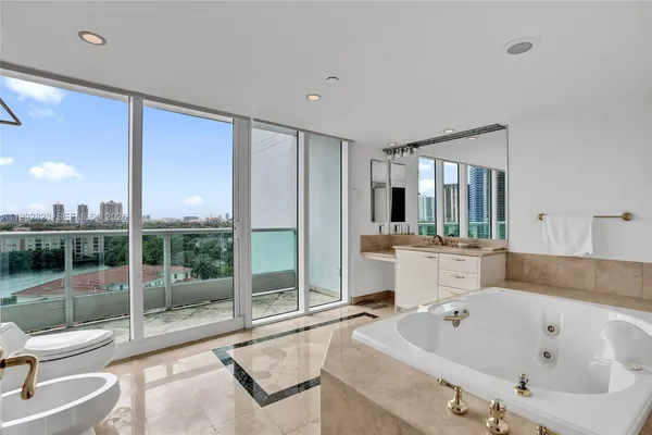 a bathroom with a tub and a sink