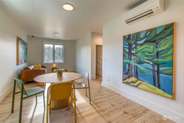 a living room with a couch and a window