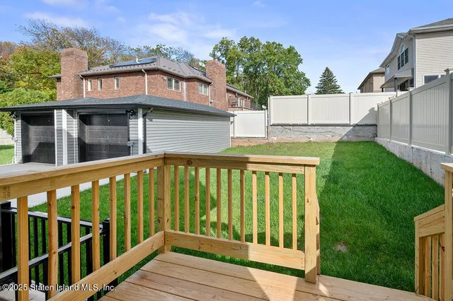 a view of a brick house with a large window