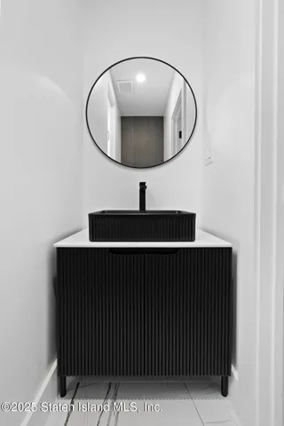 a white toilet sitting next to a small shower