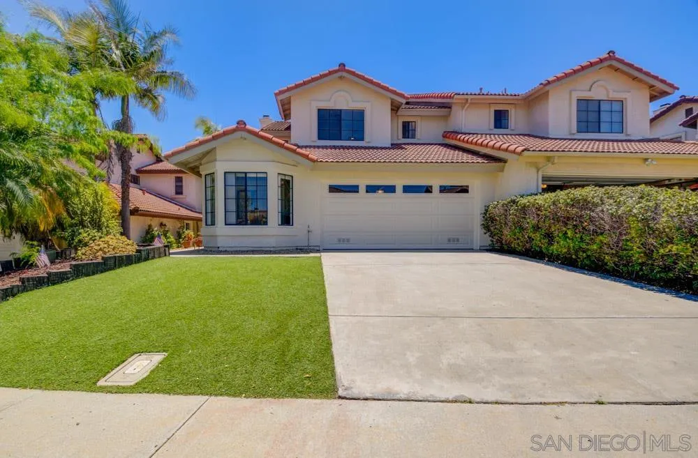 721 Summersong Lane Encinitas, CA 92024 - Photo 1 of 29 a front view of a house with a yard and garage