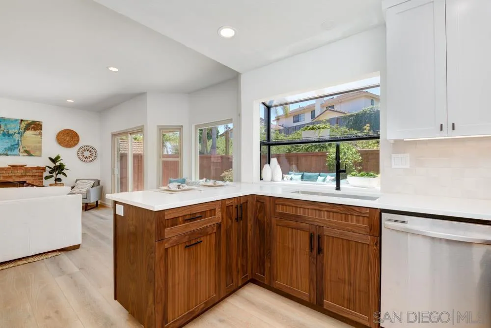 721 Summersong Lane Encinitas, CA 92024 - Photo 14 of 29 a kitchen with a sink and large window