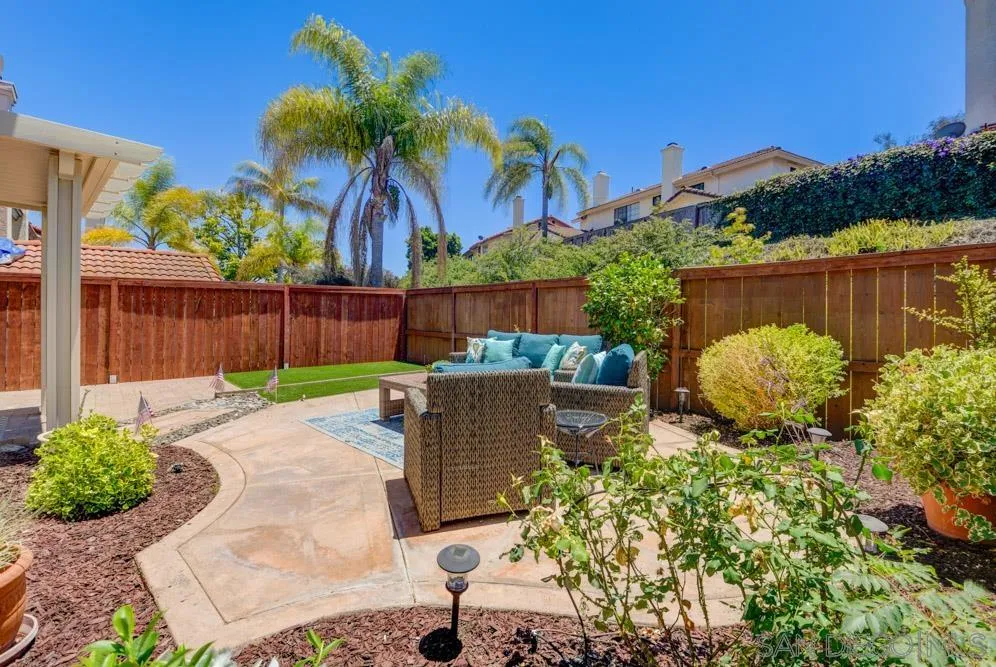 721 Summersong Lane Encinitas, CA 92024 - Photo 17 of 29 a view of a backyard with plants and a patio