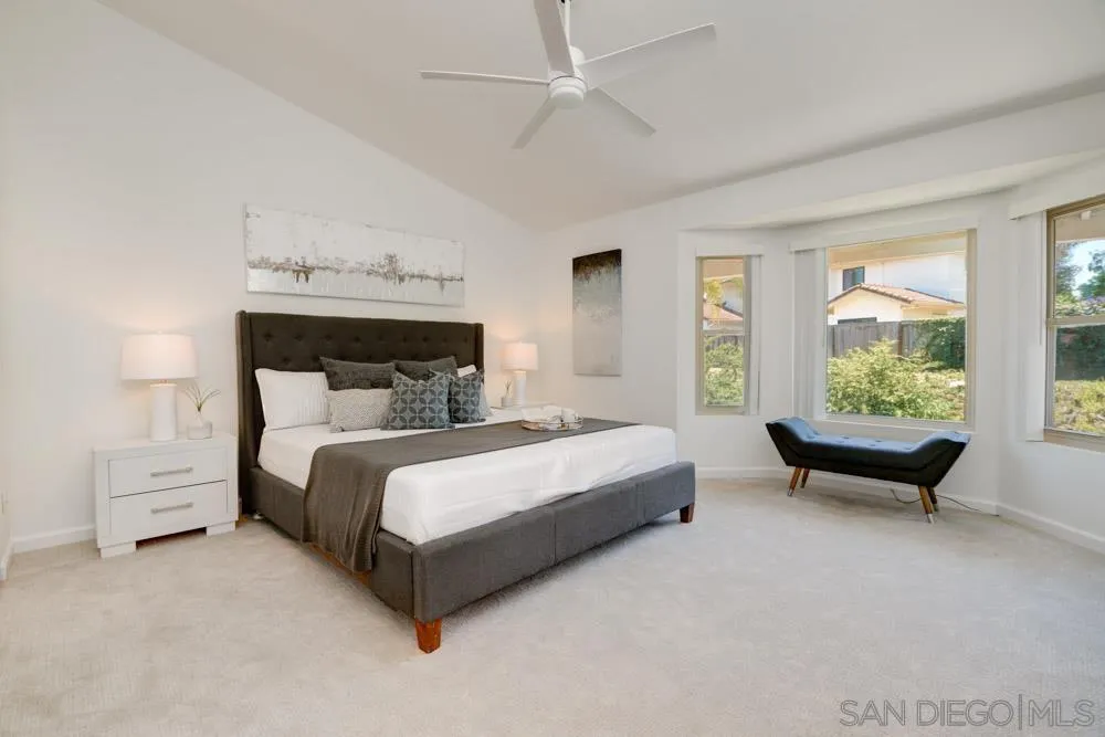 721 Summersong Lane Encinitas, CA 92024 - Photo 19 of 29 a bed room with a bed and a couch