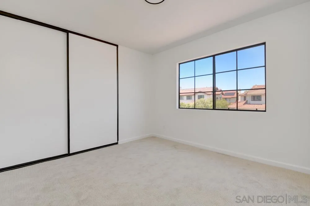 721 Summersong Lane Encinitas, CA 92024 - Photo 26 of 29 an empty room with a empty space and windows