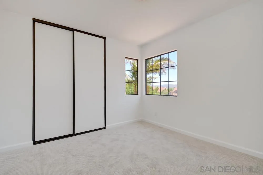 721 Summersong Lane Encinitas, CA 92024 - Photo 28 of 29 an empty room with windows and closet