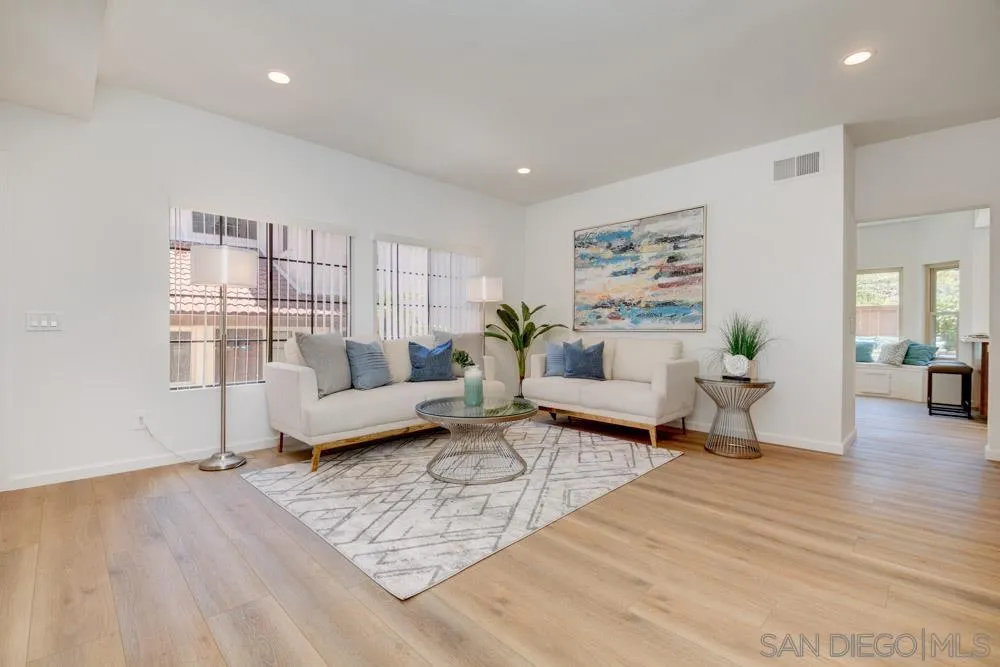 721 Summersong Lane Encinitas, CA 92024 - Photo 3 of 29 a living room with furniture and wooden floor