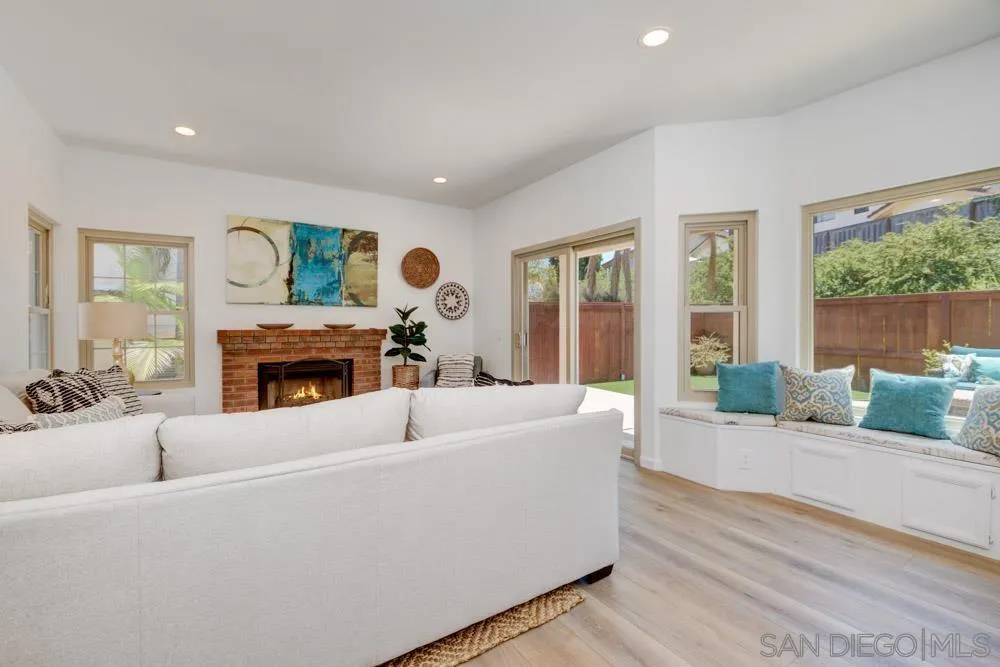 721 Summersong Lane Encinitas, CA 92024 - Photo 8 of 29 a living room with furniture and a fireplace