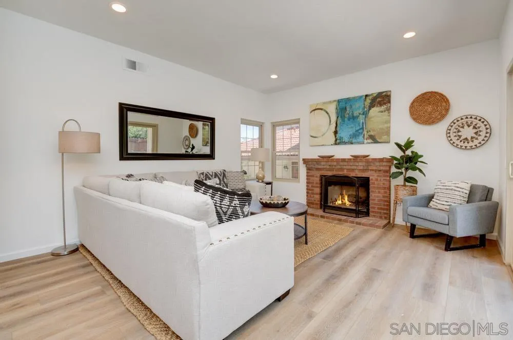 721 Summersong Lane Encinitas, CA 92024 - Photo 9 of 29 a living room with furniture and a fireplace