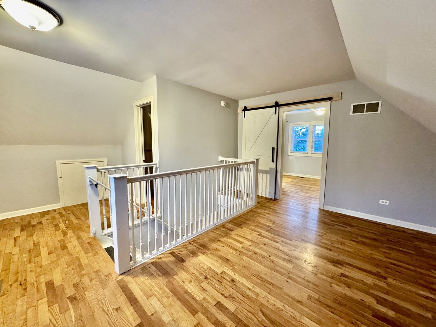 28 Batavia Road Warrenville, IL 60555 - Photo 10 of 17 a view of a hallway with wooden floor