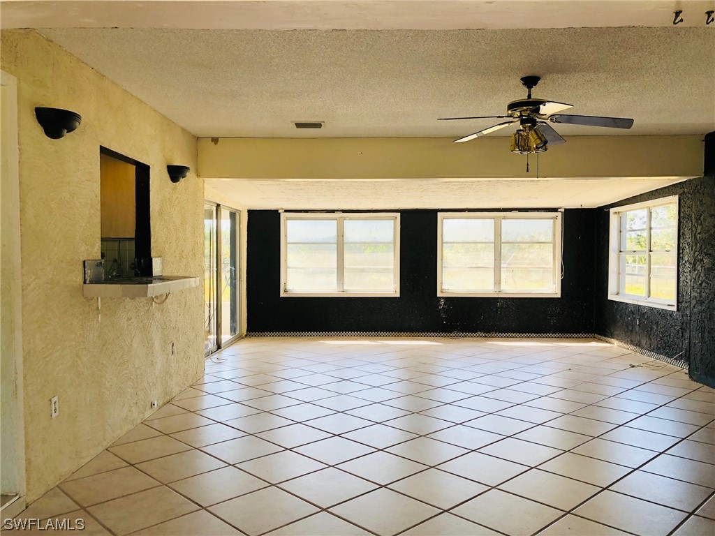 2701 W Road Fort Myers, FL 33905 - Photo 12 of 50 a view of a livingroom with a window and a fireplace