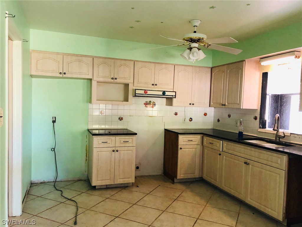 2701 W Road Fort Myers, FL 33905 - Photo 18 of 50 a kitchen with a sink cabinets and window