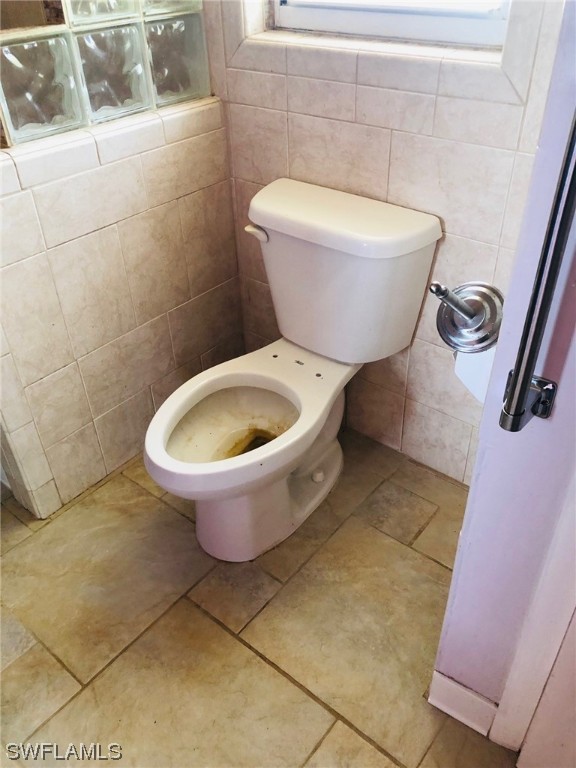 2701 W Road Fort Myers, FL 33905 - Photo 35 of 50 a white toilet sitting next to a white wall