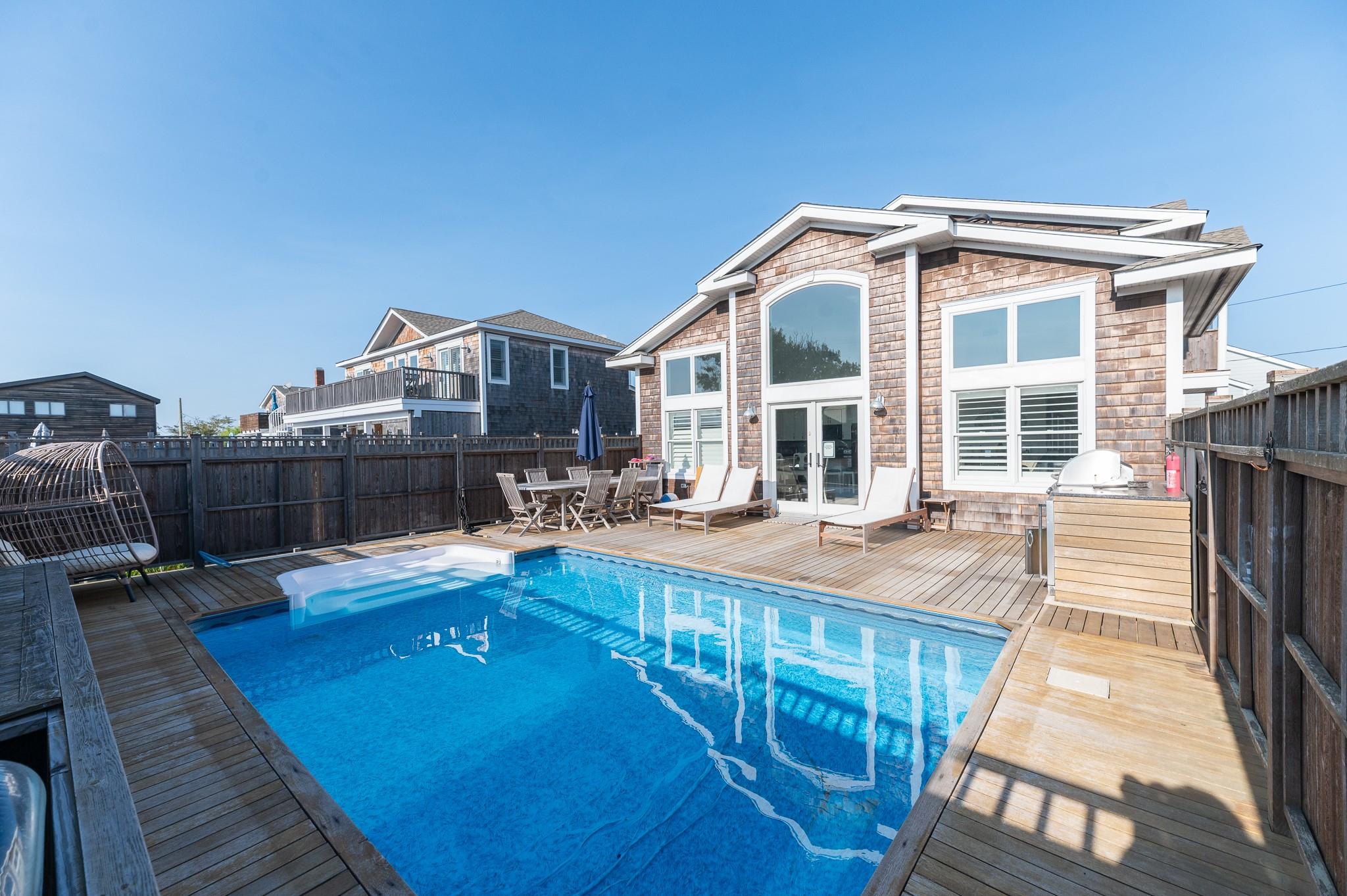 338 Surf Road Ocean Beach, NY 11770 - Photo 1 of 12 a view of a house with pool and sitting area