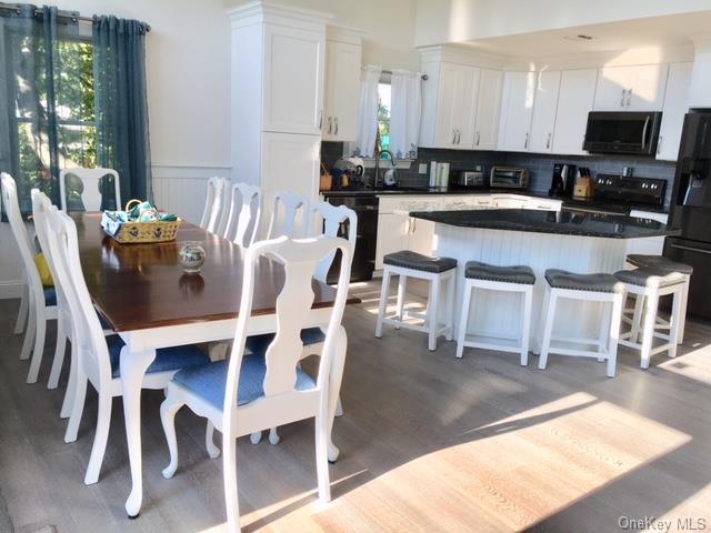338 Surf Road Ocean Beach, NY 11770 - Photo 3 of 12 Dining room featuring hardwood / wood-style flooring