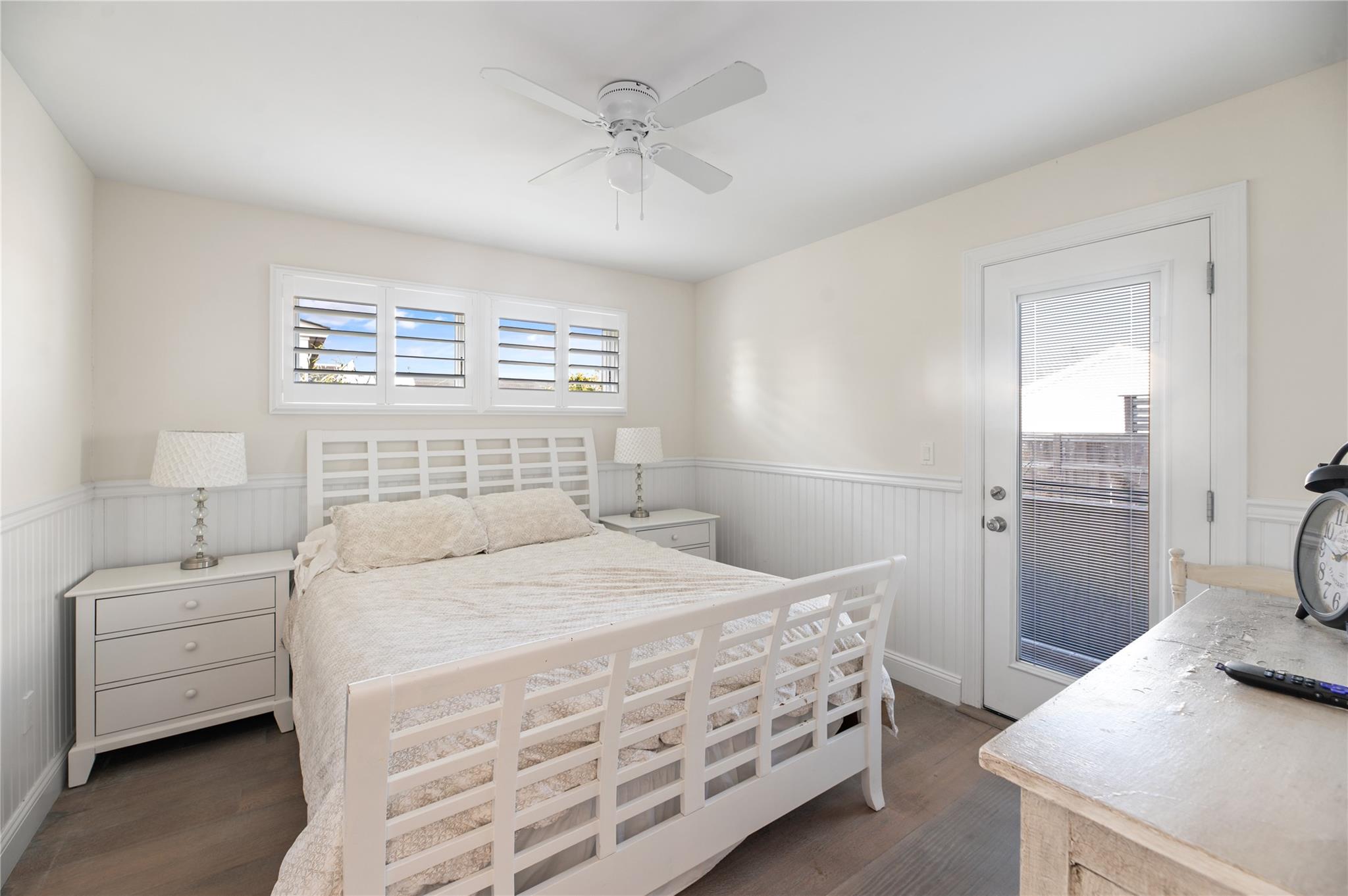 338 Surf Road Ocean Beach, NY 11770 - Photo 5 of 12 a bedroom with a bed a couch and a dresser with wooden floor