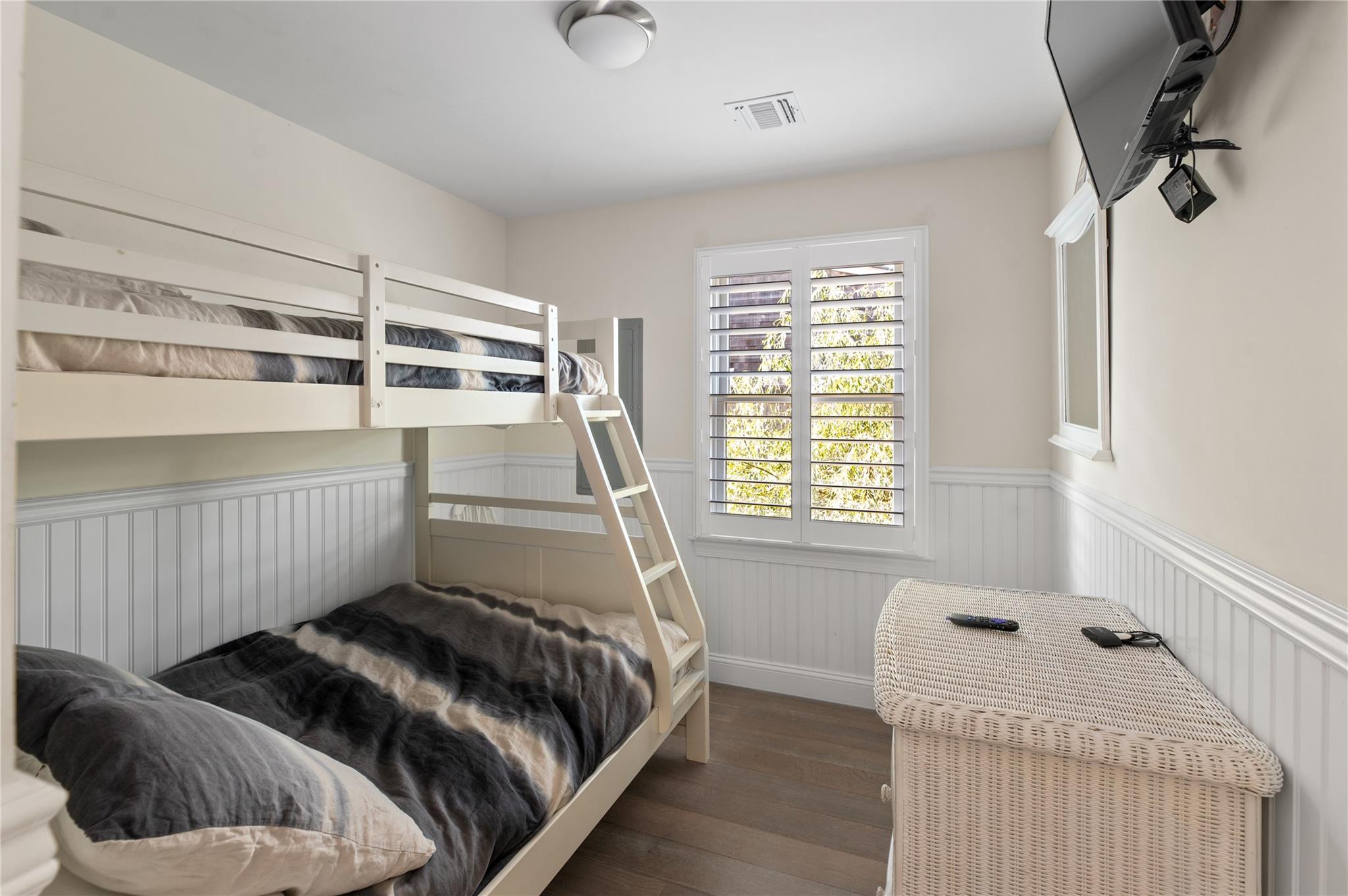 338 Surf Road Ocean Beach, NY 11770 - Photo 8 of 12 a bedroom with a bed and a window