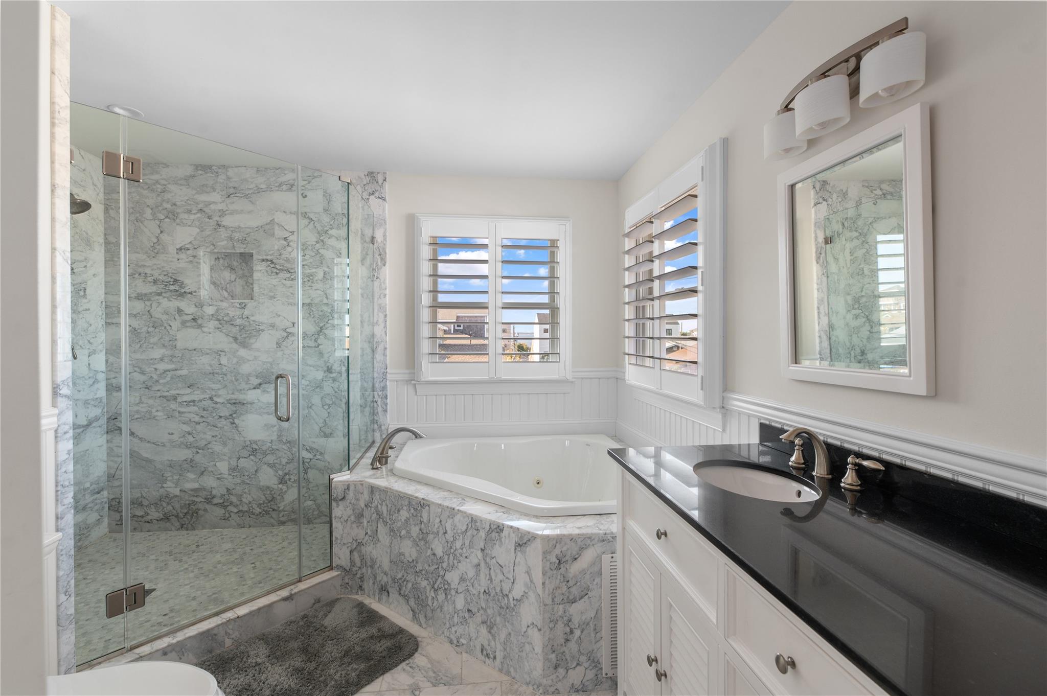 338 Surf Road Ocean Beach, NY 11770 - Photo 9 of 12 a bath room with a sink and a bath tub