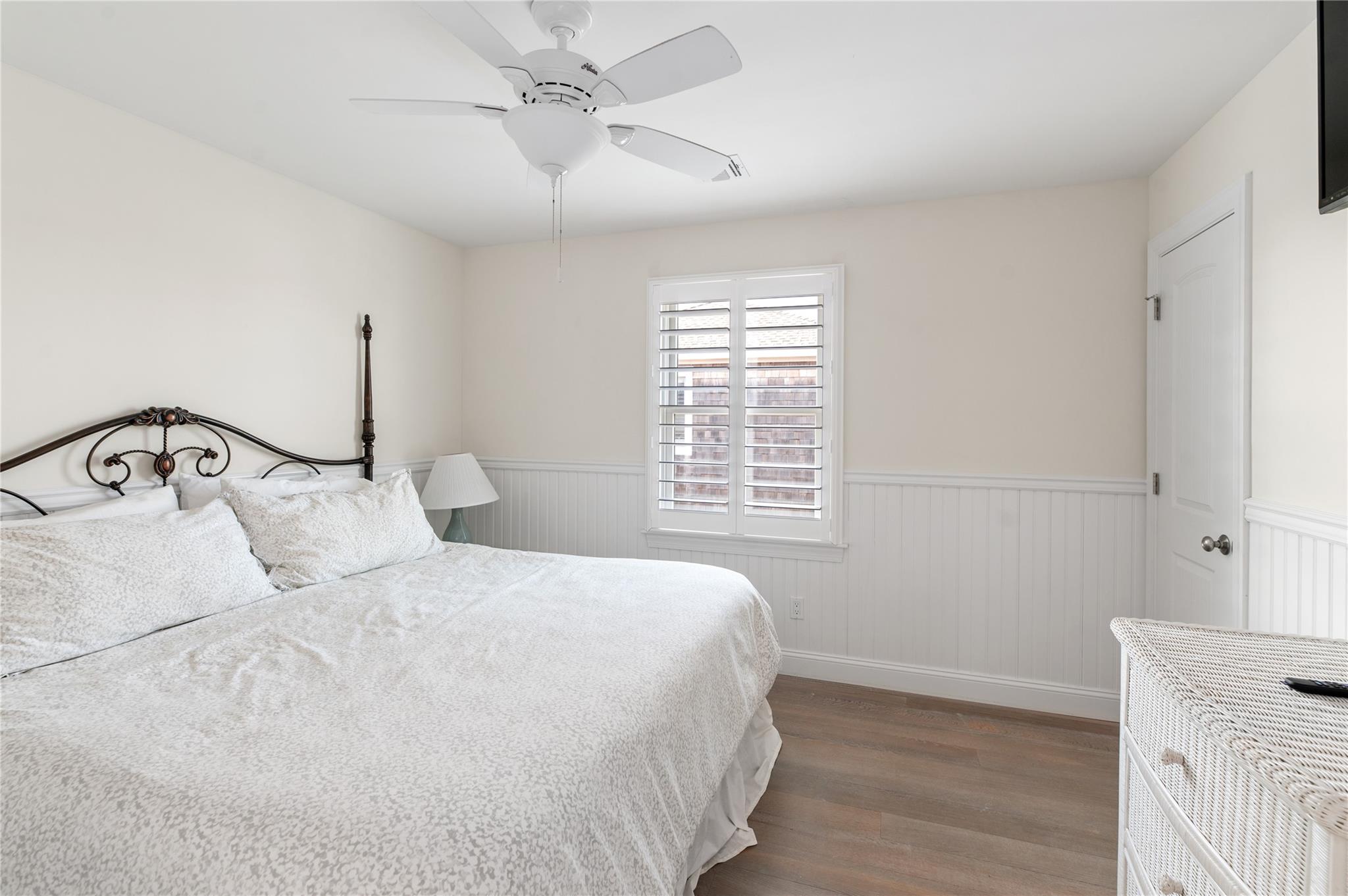 338 Surf Road Ocean Beach, NY 11770 - Photo 10 of 12 a bedroom with a bed and a window
