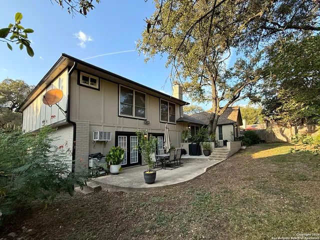 a view of the house with a yard
