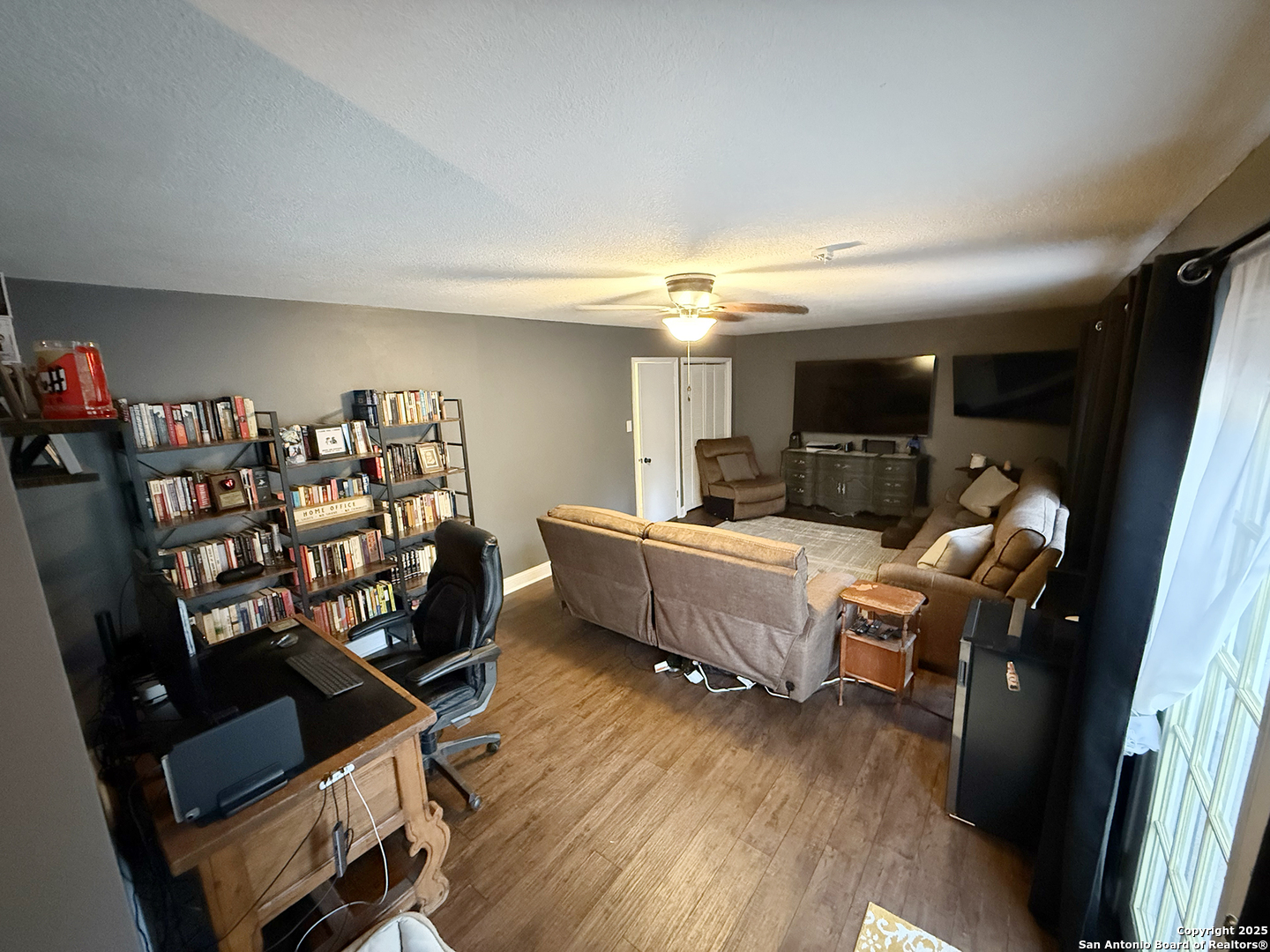 12518 Chateau Forest Lane San Antonio, TX 78230 - Photo 13 of 37 a bed room with furniture and a wooden floor