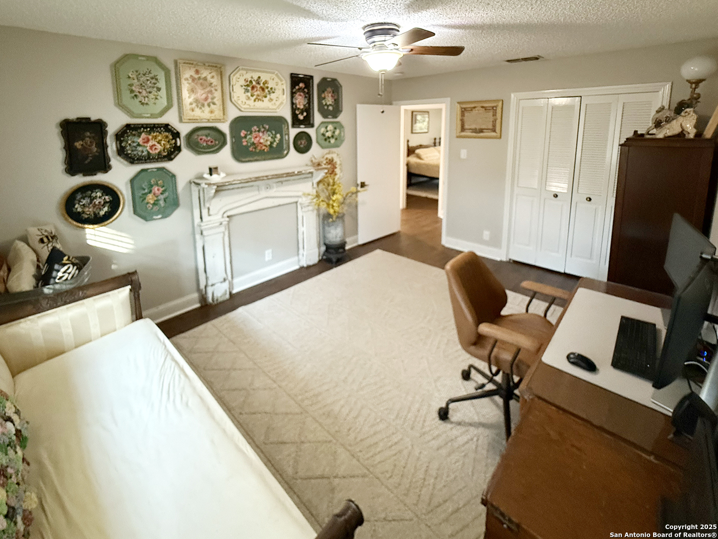 12518 Chateau Forest Lane San Antonio, TX 78230 - Photo 16 of 37 a living room with furniture and a flat screen tv