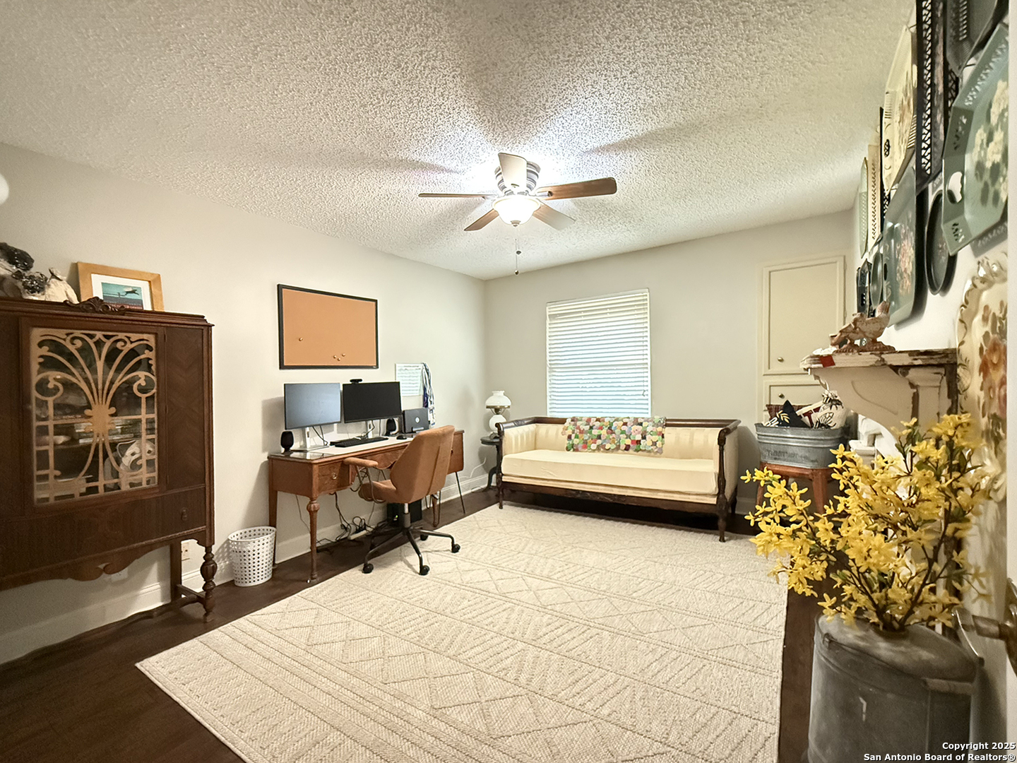 12518 Chateau Forest Lane San Antonio, TX 78230 - Photo 17 of 37 a living room with furniture and a flat screen tv