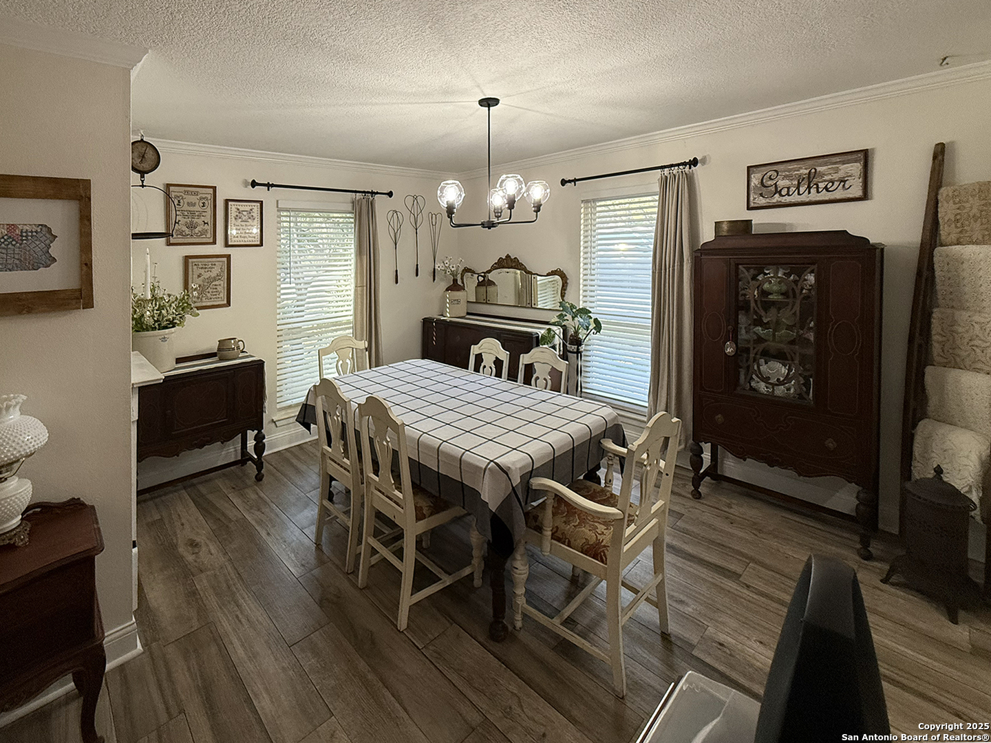 12518 Chateau Forest Lane San Antonio, TX 78230 - Photo 24 of 37 a view of a dining room with furniture window and wooden floor