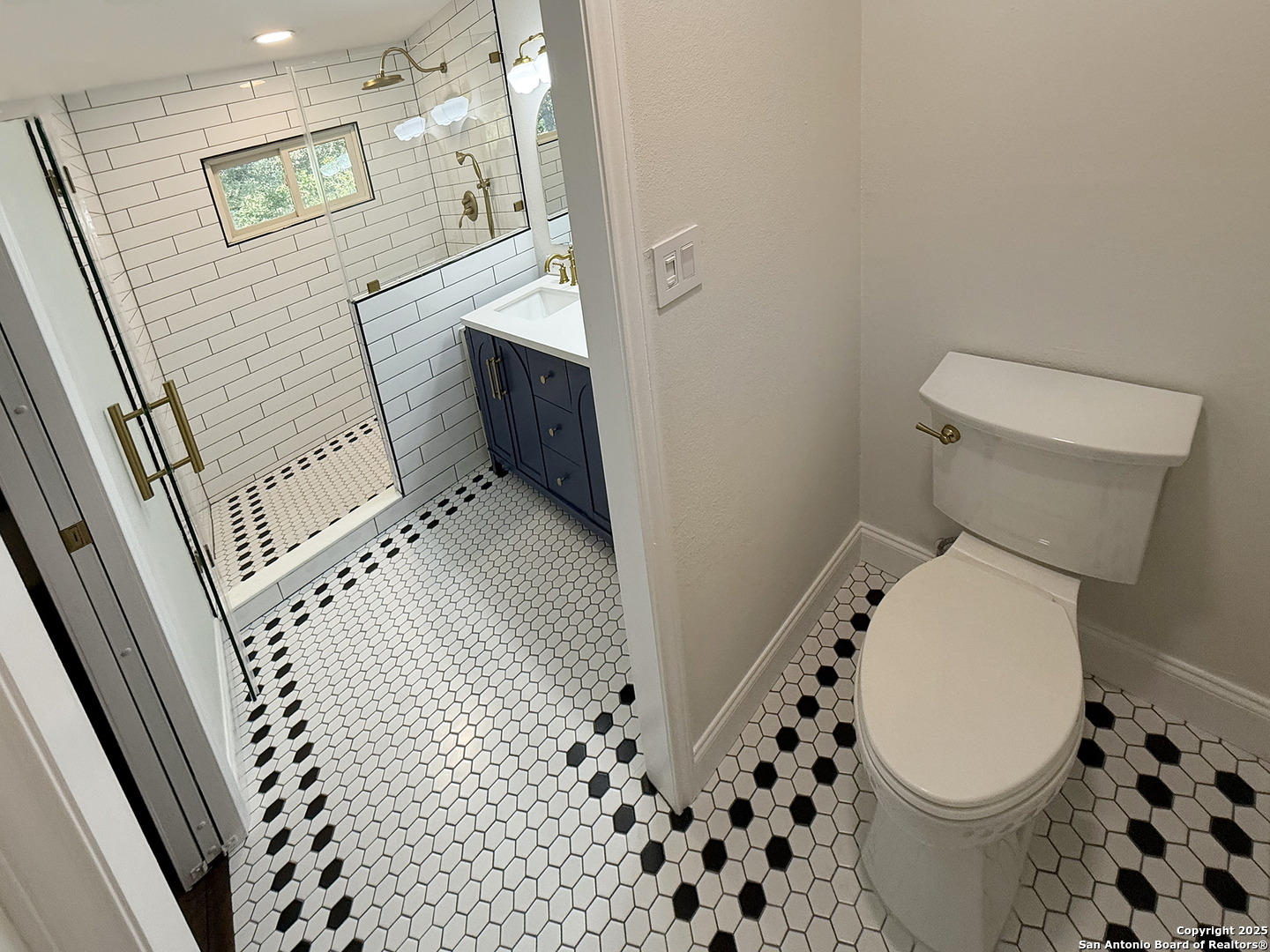 12518 Chateau Forest Lane San Antonio, TX 78230 - Photo 32 of 37 a bathroom with a toilet and a shower